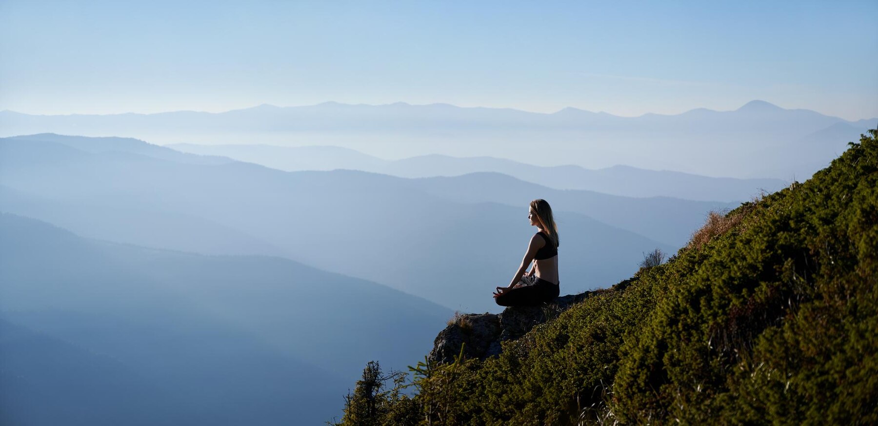 woman meditating in nature